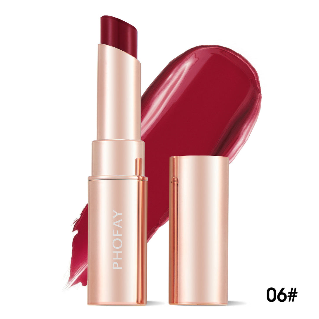 Lipstick with rose gold casing and red shade on a white background