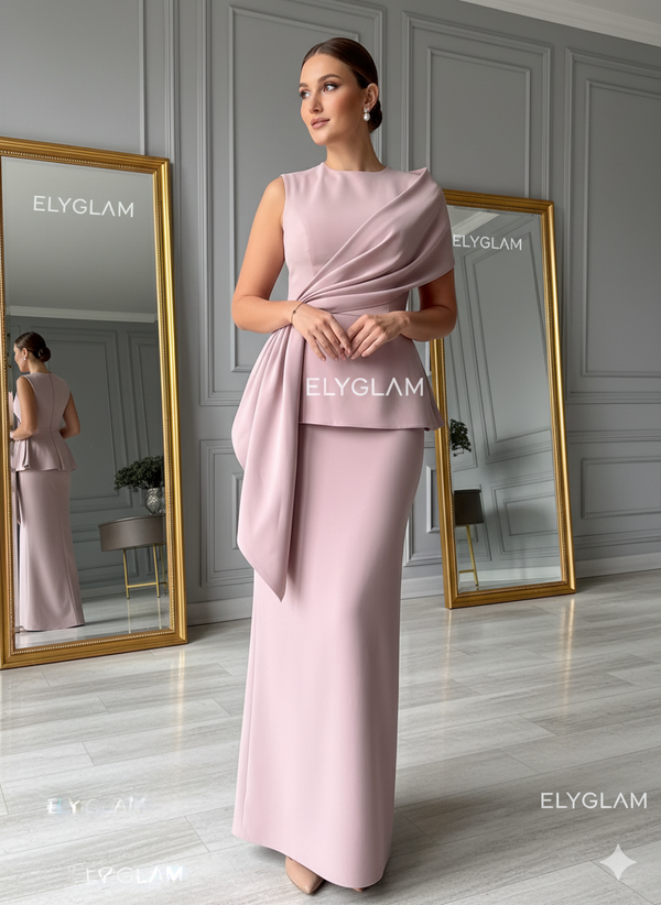 Woman in a pink dress standing between two mirrors with 'ELYGLAM' branding.