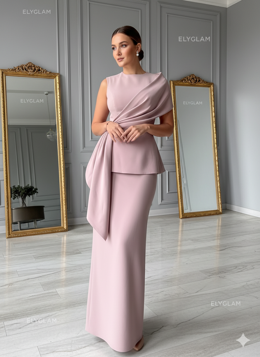 Woman in a pink dress standing in a room with mirrors and gray walls.